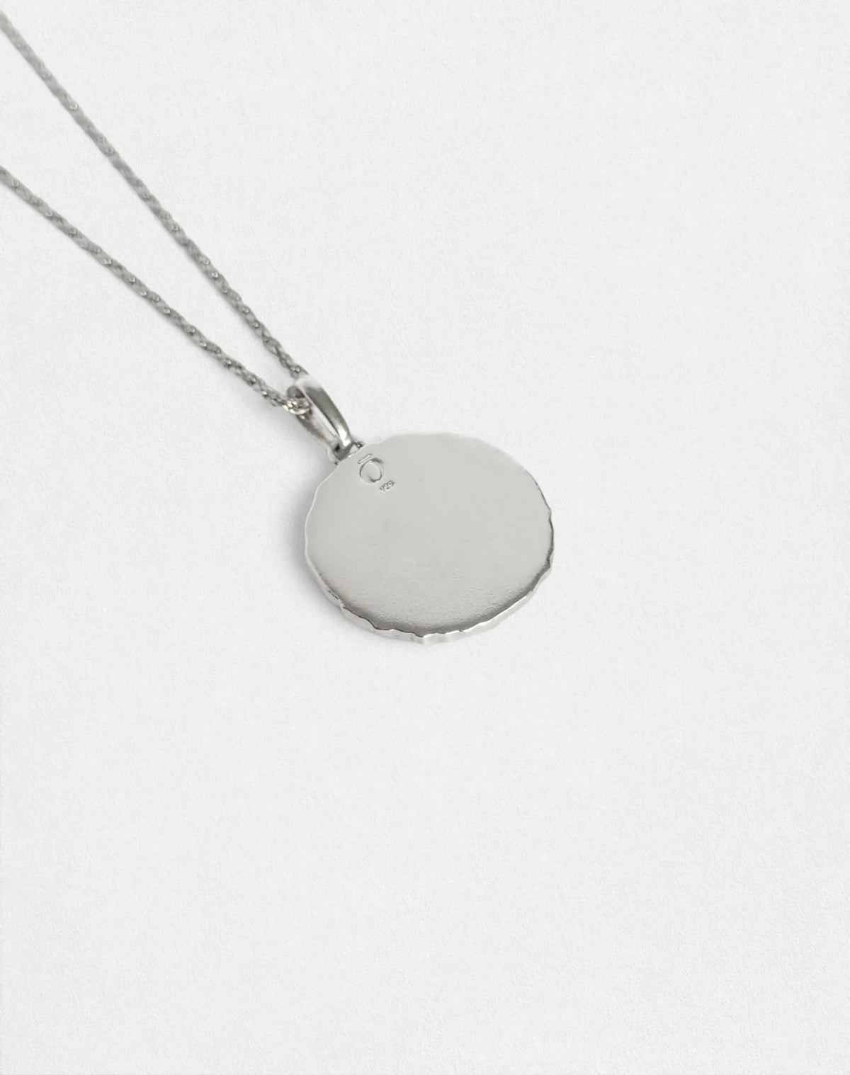 Silver Eclipse pendant necklace, back view showing OZU 925 logo.