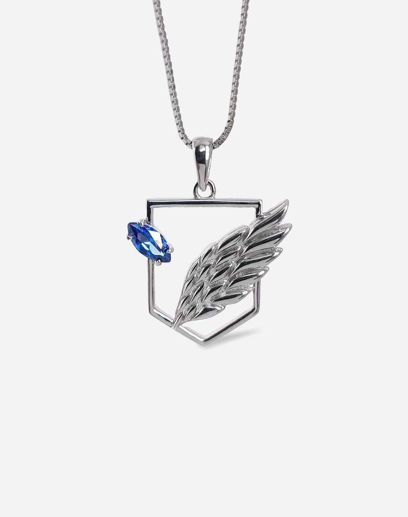 925 sterling silver Scout Pendant featuring a minimalist wing design and a blue sapphire zirconia crystal. By BOY OZU.